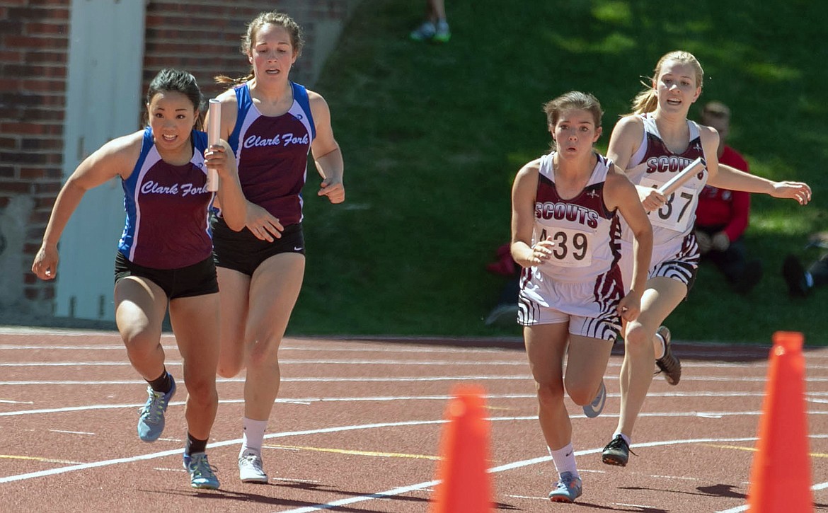 Clark Fork&#146;s Madison Mask hands off to Sophia Krutilla during the preliminary race of the short relay. The Clark Fork girls qualified for the finals race the next day at the state track meet in Great Falls. (Photo by Kylie Richter)