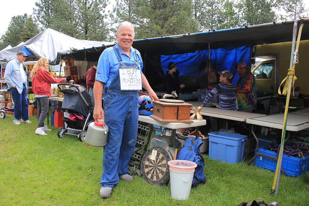 Greg, from Somers, Montana, opted for a sign instead of a booth, to draw attention to his hobby of collecting old radios at the St. Regis Flea Market on Saturday.