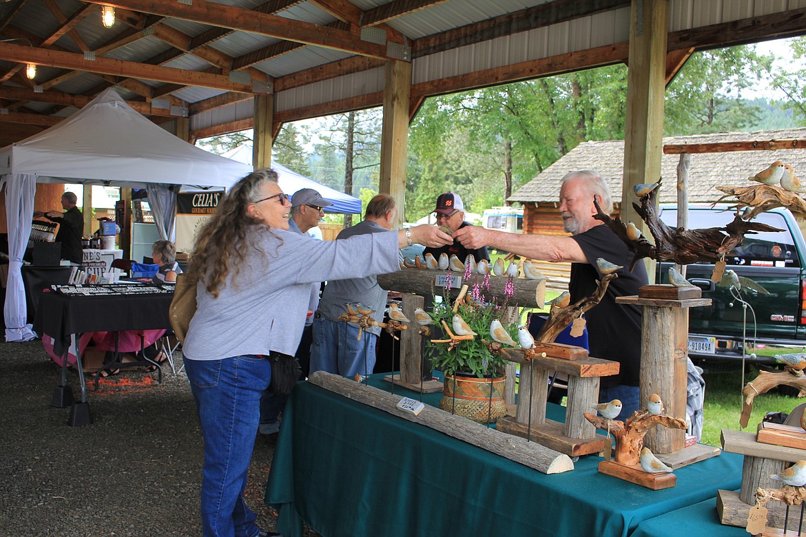 Hal Payne traveled from Santa, Idaho to sell his cement birds and koi fish ornaments at the St. Regis Flea Market.