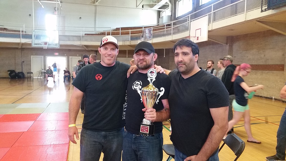 Sam Brown, Brandon Olsen and Mike Neal stand proudly after the competition.