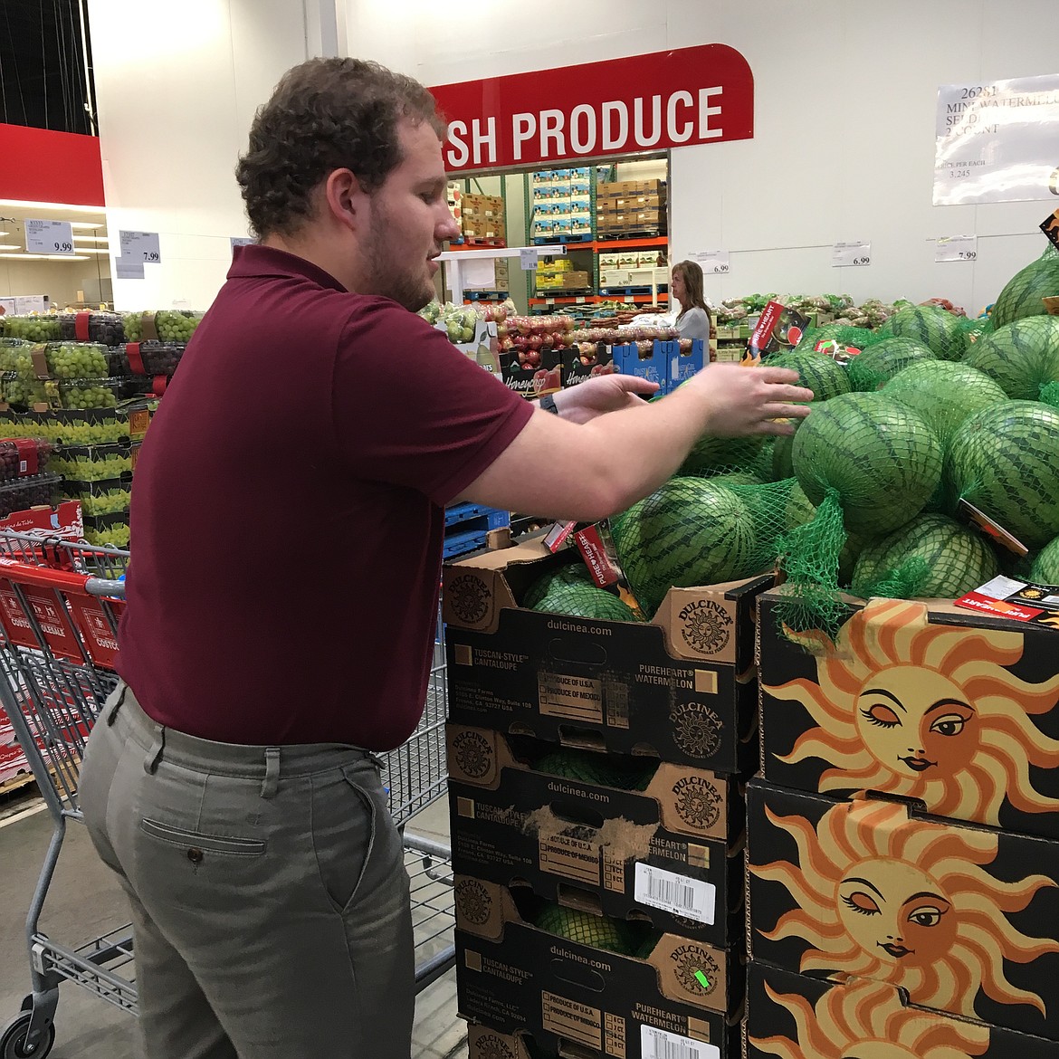 Courtesy photo
Coeur d&#146;Alene High School graduate Porter Gann, 20, stocks watermelons at Costco during his final rotation of the Project SEARCH program this spring. Gann graduated from Project SEARCH during a ceremony Wednesday. He is currently looking for employment as a merchandise stocker or courtesy clerk. &#147;He has great references,&#148; said program instructor Theresa Moran. &#147;He has several applications out to retailers here.&#148;