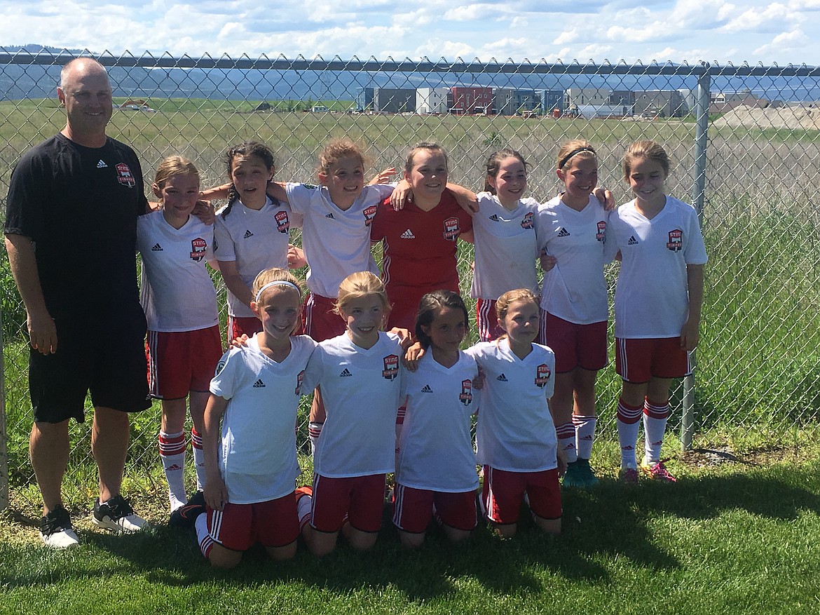 Courtesy photo
The Sting Timbers 07 Girls soccer team closed out its spring tournament season with two strong wins in the gold bracket of the Three Blind Refs Tournament in Kalispell. In the front row from left are Natalie Thompson, Emma Decker, Kate Mauch and Avery Hickok; and back row from left, coach Mike Thompson, Paige Hunt, Annabelle Rogers, Evelyn Bowie, Emma Singleton, Zayda Voight, Rachel Corette and Sofia Peressini.