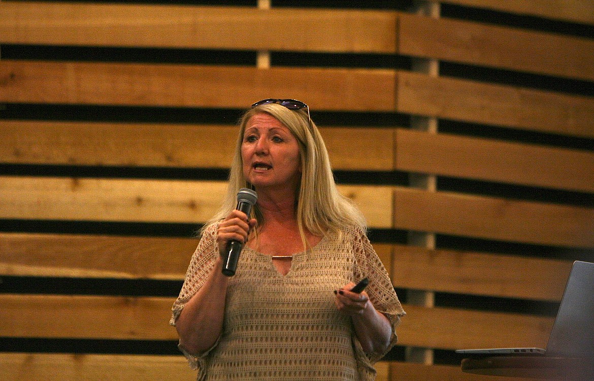 BRIAN WALKER/Press
Paula Barthelmess, with the Community Outreach Behavioral Services nonprofit, spoke to about 125 people attending a seminar on human trafficking on Monday night at Lake City Church in Coeur d&#146;Alene.