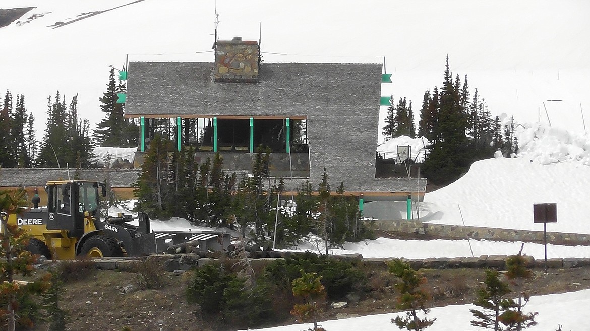 Glacier National Park&#146;s Logan Pass Visitor Center still has some snow to be cleared from the area before it can open. Snow removal operators from the West and East sides met just east the Center Thursday. (Scott Shindledecker/Daily Inter Lake)