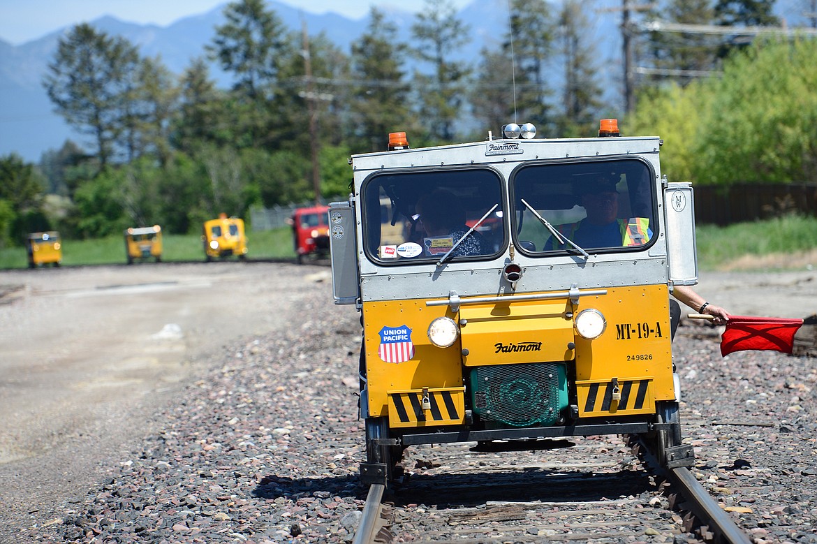 Railcars head through Kalispell during a tour of the Kalispell Core Area on Thursday. (Casey Kreider/Daily Inter Lake)