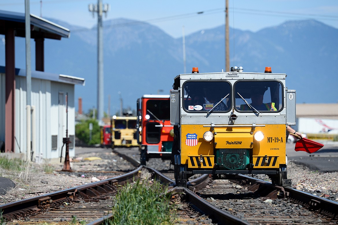 Railcars head through west Kalispell during a tour of the Kalispell Core Area on Thursday. (Casey Kreider/Daily Inter Lake)