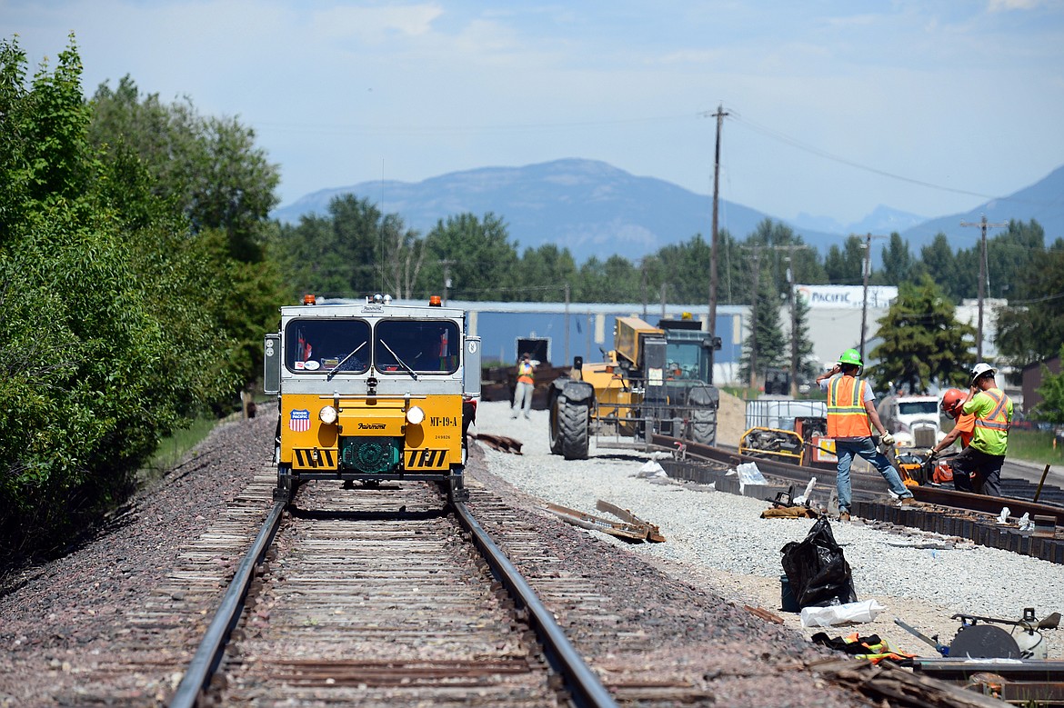 Workers remove track in east Kalispell during a railcar tour through the Kalispell Core Area on Thursday. (Casey Kreider/Daily Inter Lake)