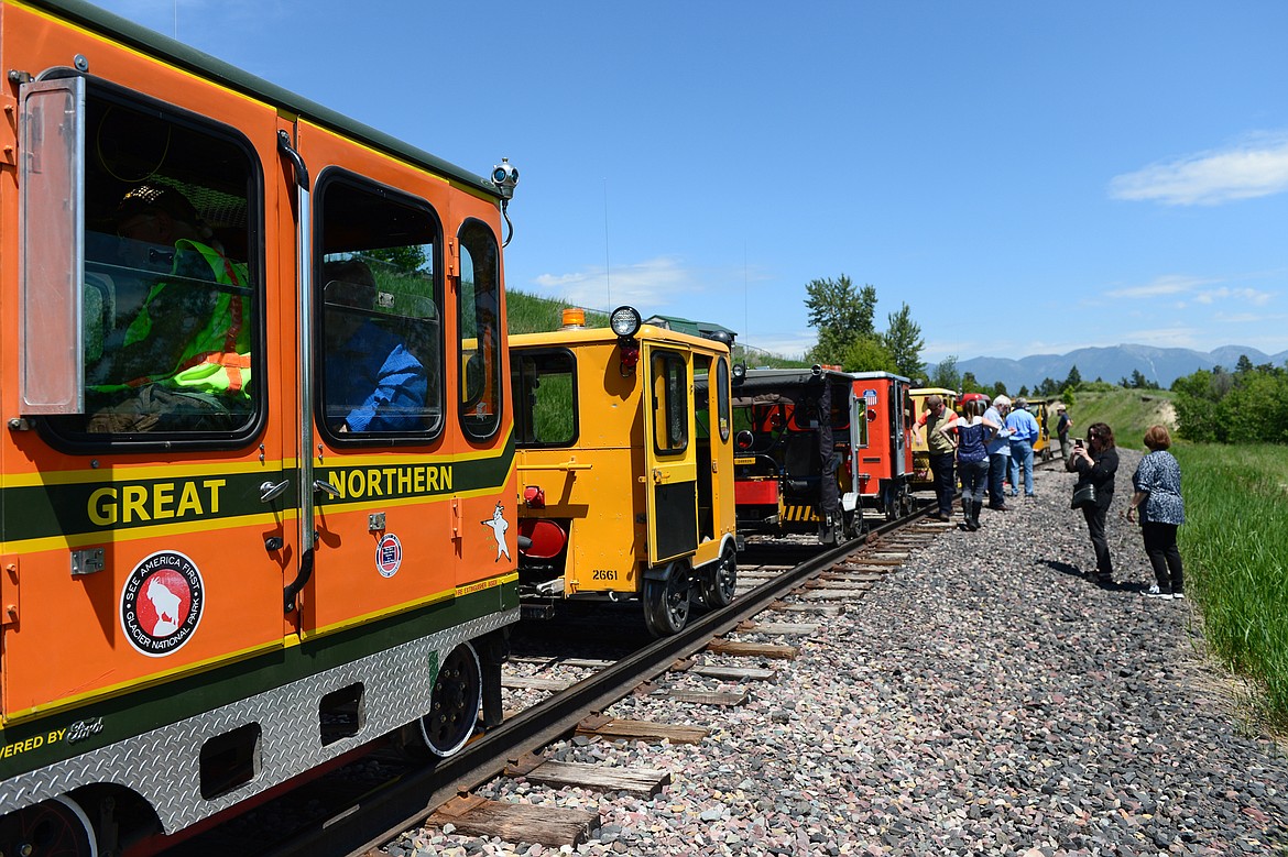 Passengers exit the railcars above Woodland Park during a railcar tour through the Kalispell Core Area on Thursday. (Casey Kreider/Daily Inter Lake)