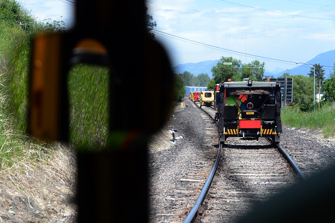 Railcars head east through Kalispell during a tour of the Kalispell Core Area on Thursday. (Casey Kreider/Daily Inter Lake)