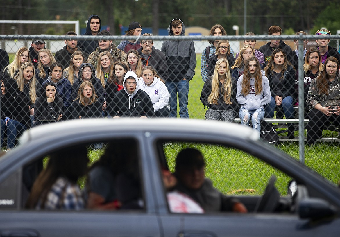 Lakeland High School students watch Peyton Graham, Chris Hunt, Cade Felton and Jessi Hall as they take part in a mock drunk driving crash Friday morning at Lakeland Jr High School. (LOREN BENOIT/Press)
