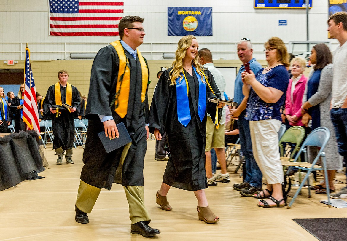 Kevin Lee and Laurynn Lauer of Libby High School&#146;s Class of 2018 leave the graduation ceremony Saturday, June 2, 2018. 
(John Blodgett/The Western News)