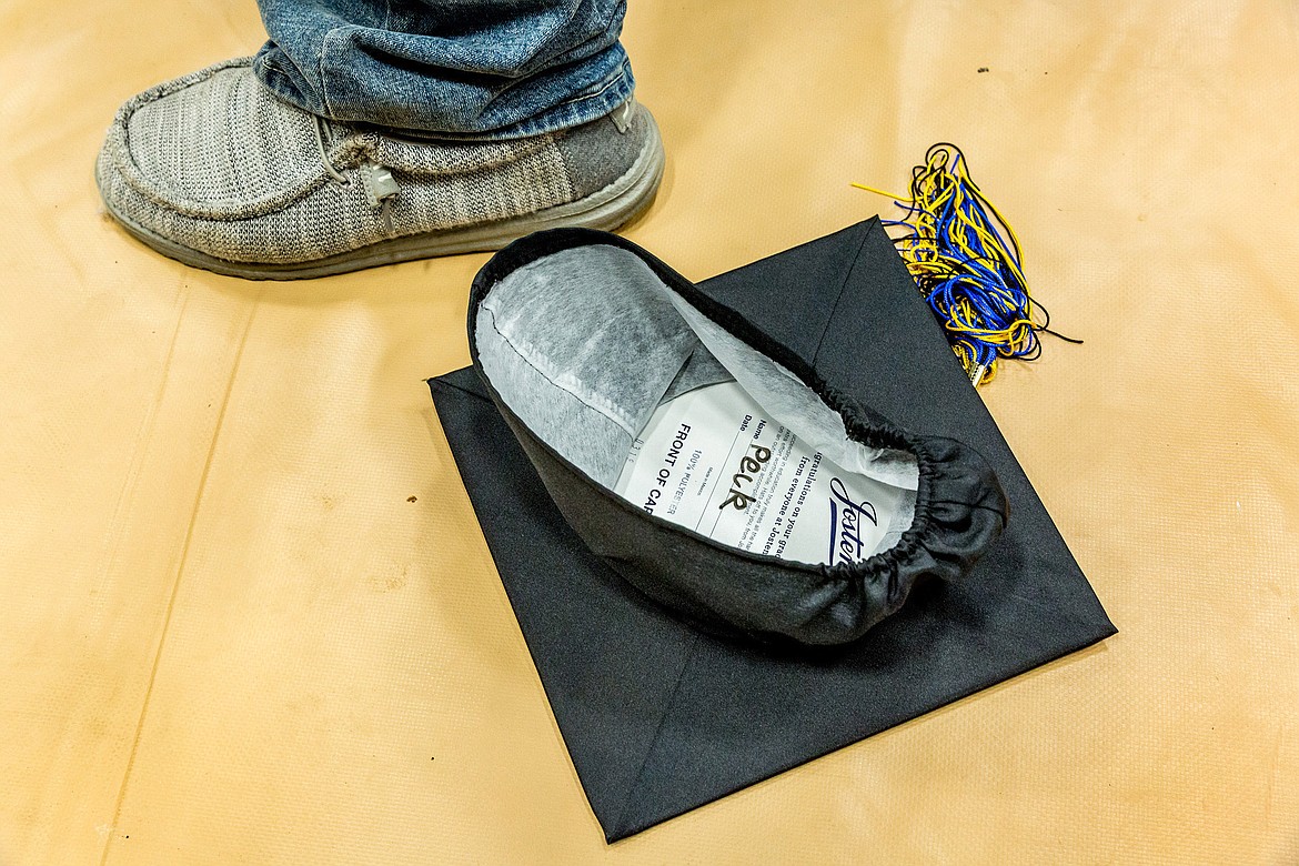 The cap of Libby High School Class of 2018 salutatorian Brian Peck came to rest dozens of feet from where he threw it at the end of graduation on Saturday, June 2, 2018. 
(John Blodgett/The Western News)