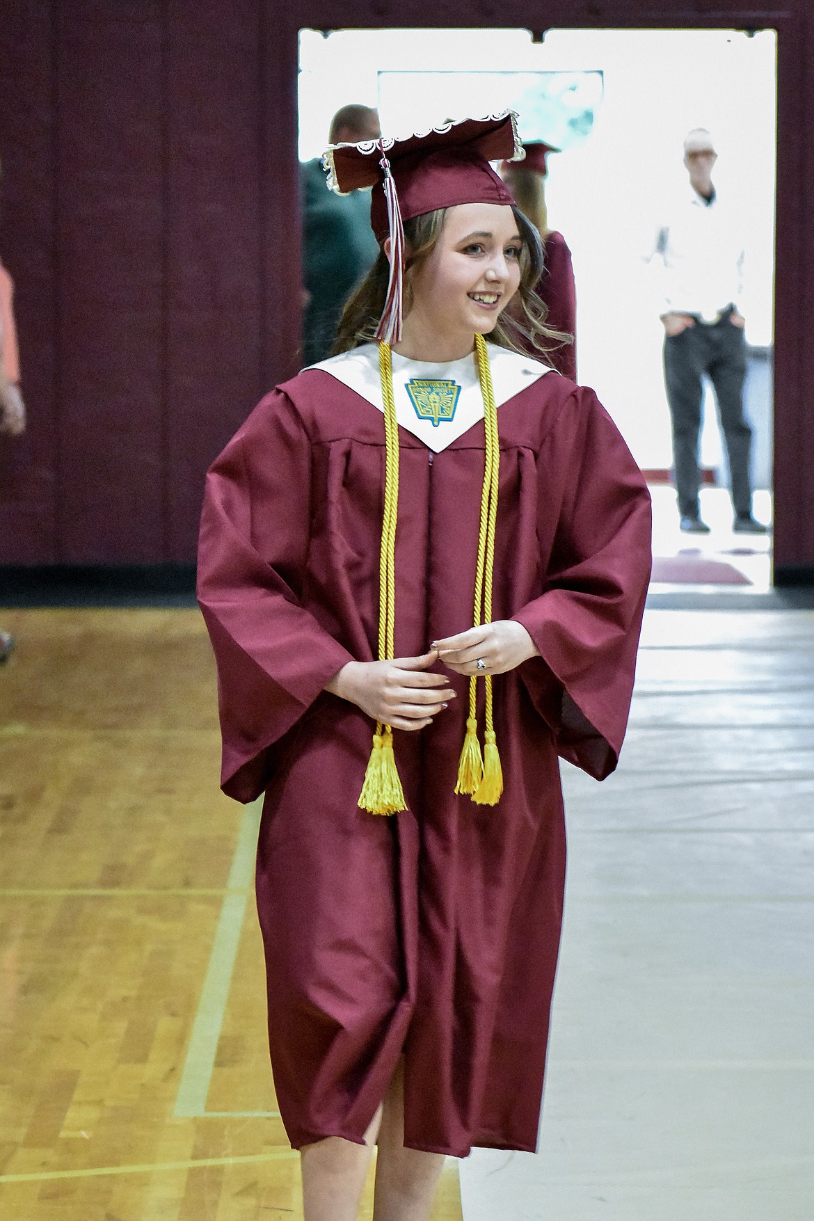 Troy's Kaylee Kidwell enters the Troy School Activity Center auditorium for graduation on  Saturday, June 2, 2018. (Ben Kibbey/The Western News)