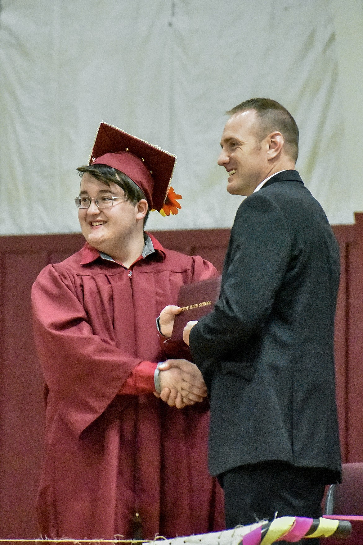 Troy's Johnathn Fossen receives his diploma at the Troy School Activity Center auditorium during graduation on Saturday, June 2, 2018. (Ben Kibbey/The Western News)