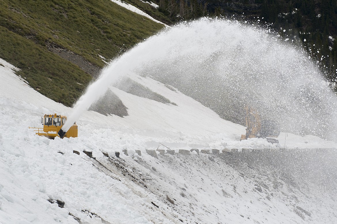 Snow removal teams work near Logan Pass in Glacier National Park Thursday. Snow levels are low, but the park has not yet set an opening date for the Going to the Sun Road. (Jeremy Weber photo)