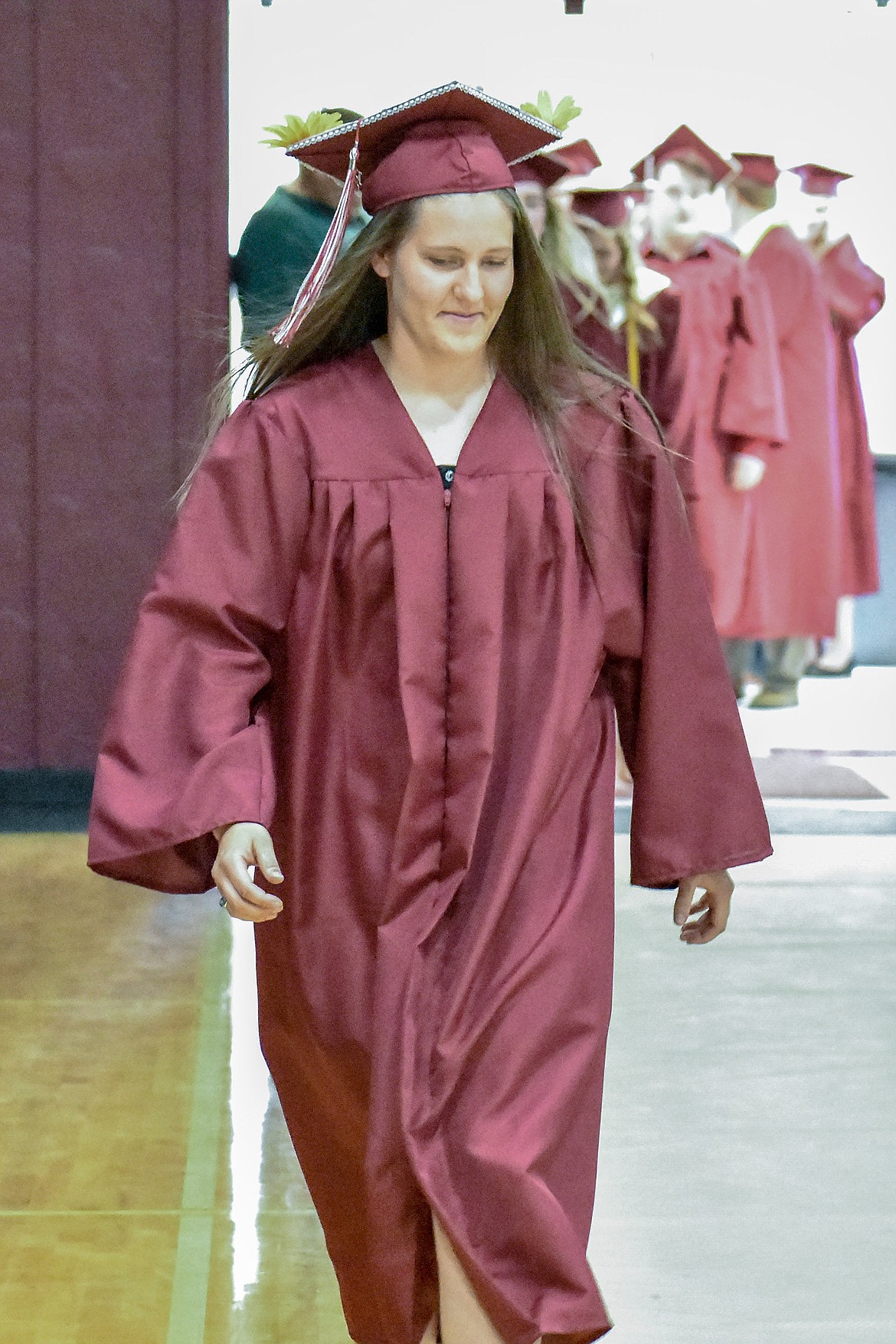 Troy's Allie Coldwell enters the Troy School Activity Center auditorium for graduation on  Saturday, June 2, 2018. (Ben Kibbey/The Western News)