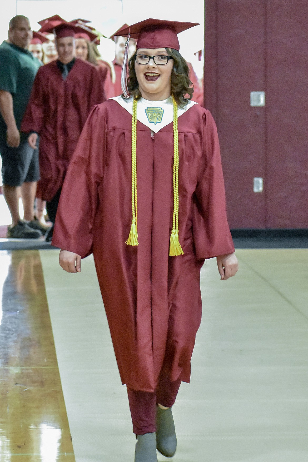 Troy's Desirae Bowers enters the Troy School Activity Center auditorium for graduation on Saturday, June 2, 2018.
