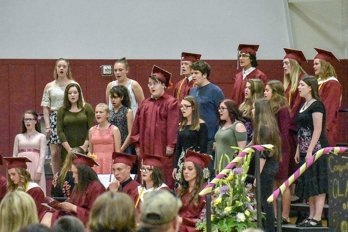 The Troy High School Choir, including a few members who were graduating, sings &#147;And Wherever You Go&#148; during graduation ceremonies Saturday.