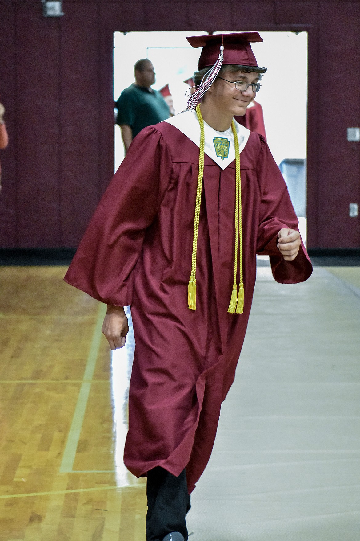 Troy's AJ Faur enters the Troy School Activity Center auditorium for graduation on  Saturday, June 2, 2018. (Ben Kibbey/The Western News)