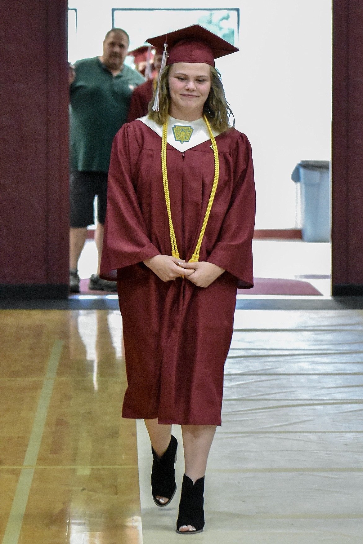 Troy's Hailey Hoban enters the Troy School Activity Center auditorium for graduation on  Saturday, June 2, 2018. (Ben Kibbey/The Western News)