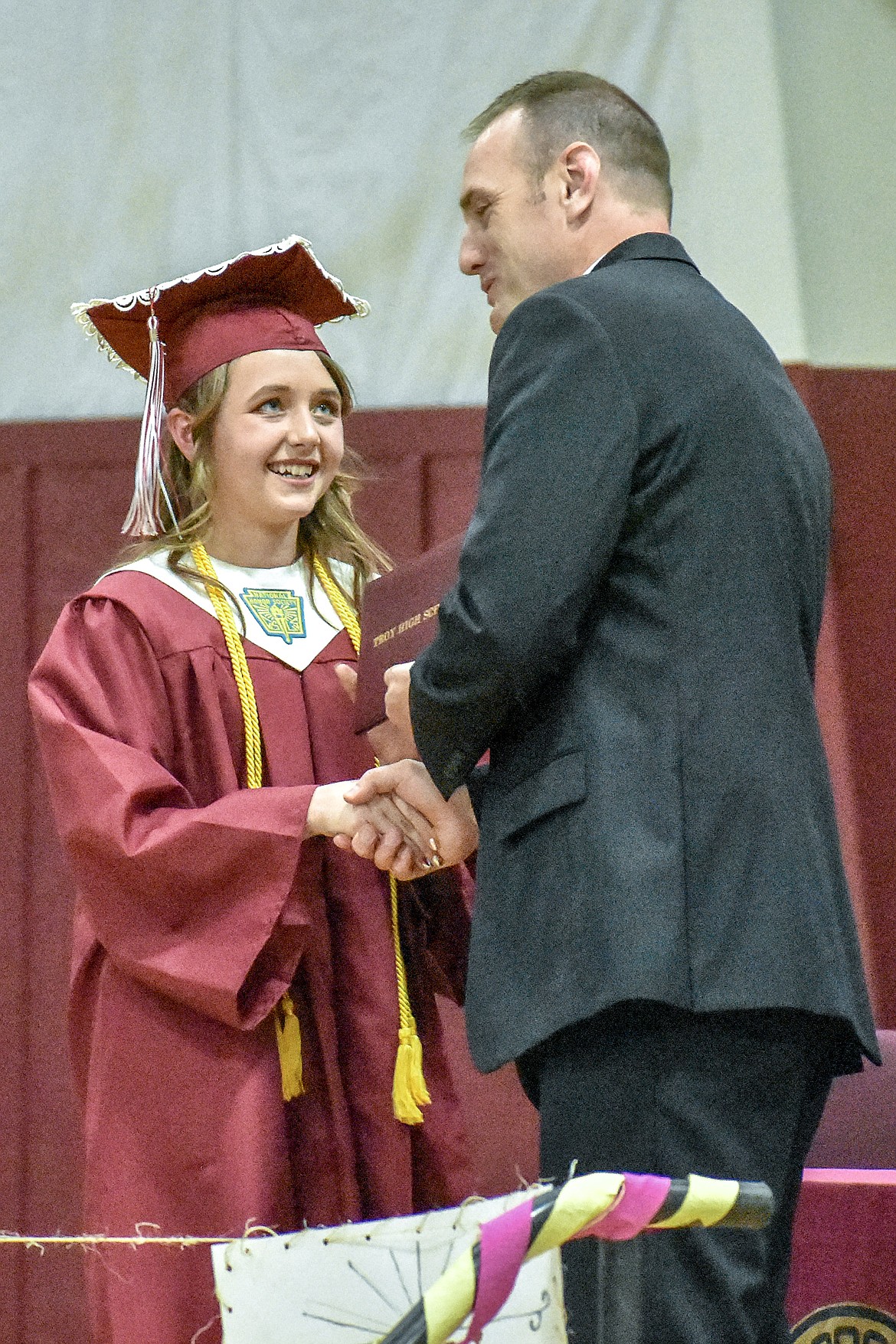 Troy's Kaylee Kidwell receives her diploma at the Troy School Activity Center auditorium during graduation on Saturday, June 2, 2018. (Ben Kibbey/The Western News)