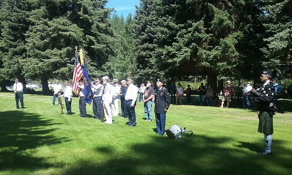 On Memorial Day, members of the local color guard and community gathered at the St. Regis Cemetary to honor those who have died in active military service. (Photo by Denley Loge)