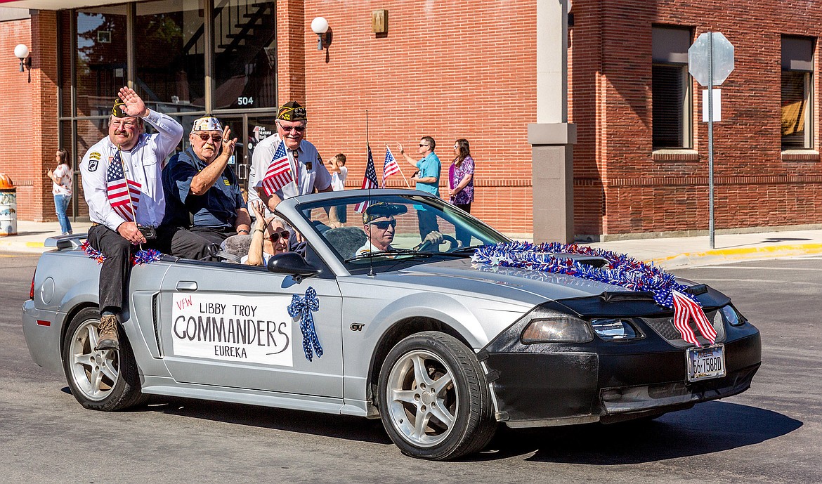 Area VFW Post commanders &#151; from left, Rob Hughes (Libby), Bud Priest (Troy) and Terry Beazley (Eureka) &#151; ride in the Memorial Day parade on Mineral Avenue in Libby on Sunday, May 27, 2018. Keith Kenelty is is driving, and Stella Sharp rides shotgun. (John Blodgett/The Western News)