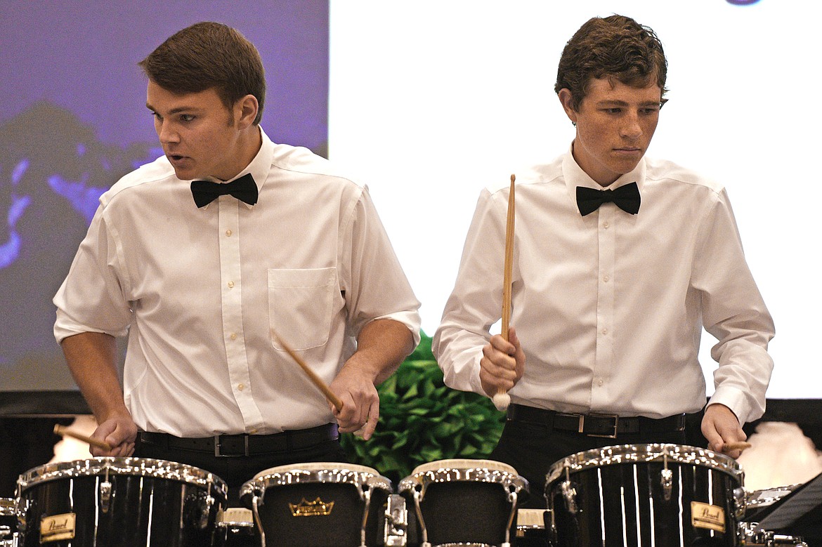 Graduating seniors Trevor Woodward and Keegan Siebenaler perform on the drums during the graduation prelude at the Glacier High School Class of 2018 commencement on Saturday. (Casey Kreider/Daily Inter Lake)