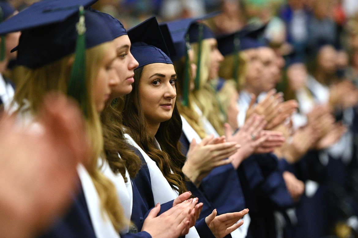 Graduating seniors applaud after a speaker during the Glacier High School Class of 2018 commencement on Saturday. (Casey Kreider/Daily Inter Lake)