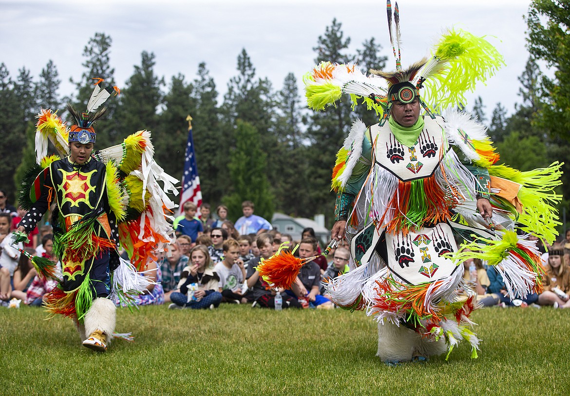 Wearing traditional regalia, Butch Nomee, of The Coeur d&#146;Alene Tribe, and his son Tsanes show Ponderosa Elementary School students a Men&#146;s Fancy Dance during Ponderosa&#146;s Rendevous Day on Thursday. (LOREN BENOIT/Press)