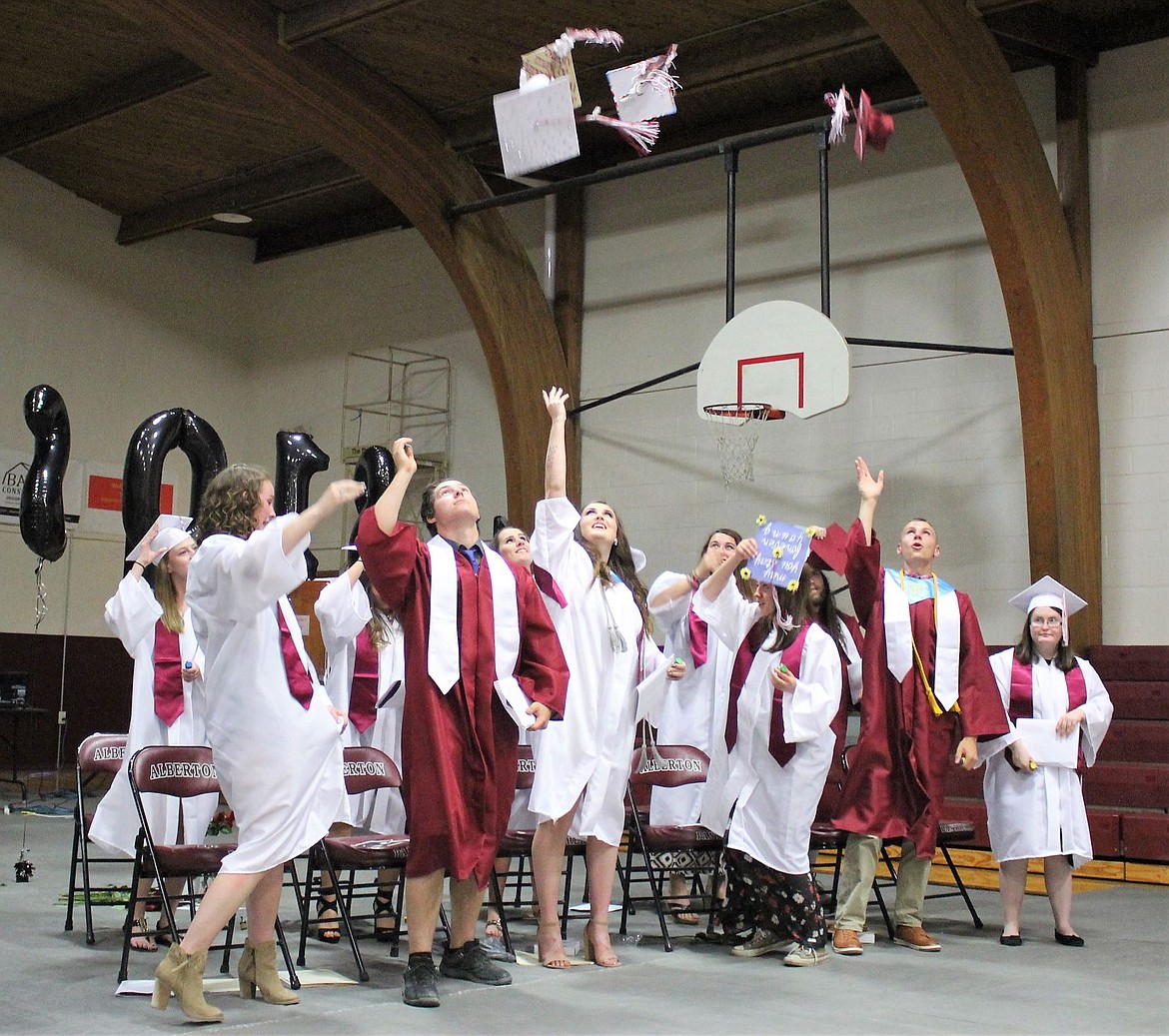 The 2018 Alberton graduating class celebrates with a hat toss on graduation day on Monday, May 28. (Kathleen Woodford/Mineral Independent)