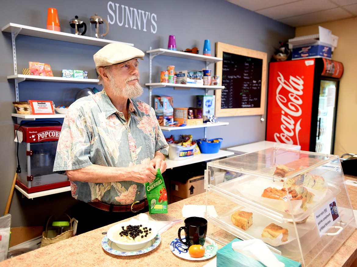 Michael Waters making breakfast at &quot;Sunny's&quot; the snack bar at the Village at Sunburst Mental Health. Although host is not his official title, Waters is often the first person new people interact with when they come to the facility.(Brenda Ahearn/Daily Inter Lake)