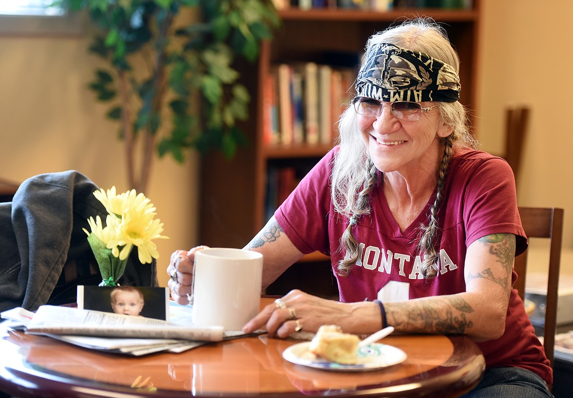 Sally &quot;Stoney&quot; Wise enjoys coffee and a cinnamon roll for breakfast at the Village at Sunburst Mental Health on Thursday, May 31, in Kalispell.(Brenda Ahearn/Daily Inter Lake)