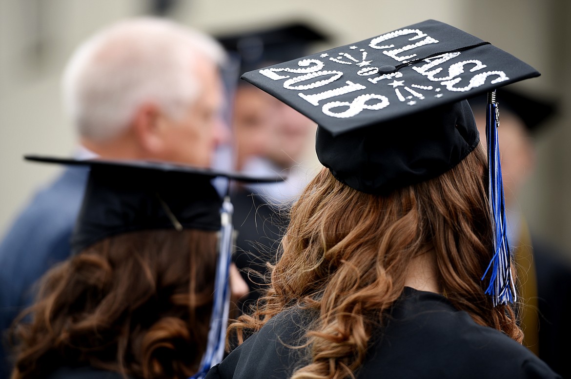 Seniors at Stillwater Christian School gather for a prayer before the start of the commencement ceremony on Friday night, June 1. Twenty three students were awarded their diplomas in the school's 32nd graduating class.(Brenda Ahearn/Daily Inter Lake)