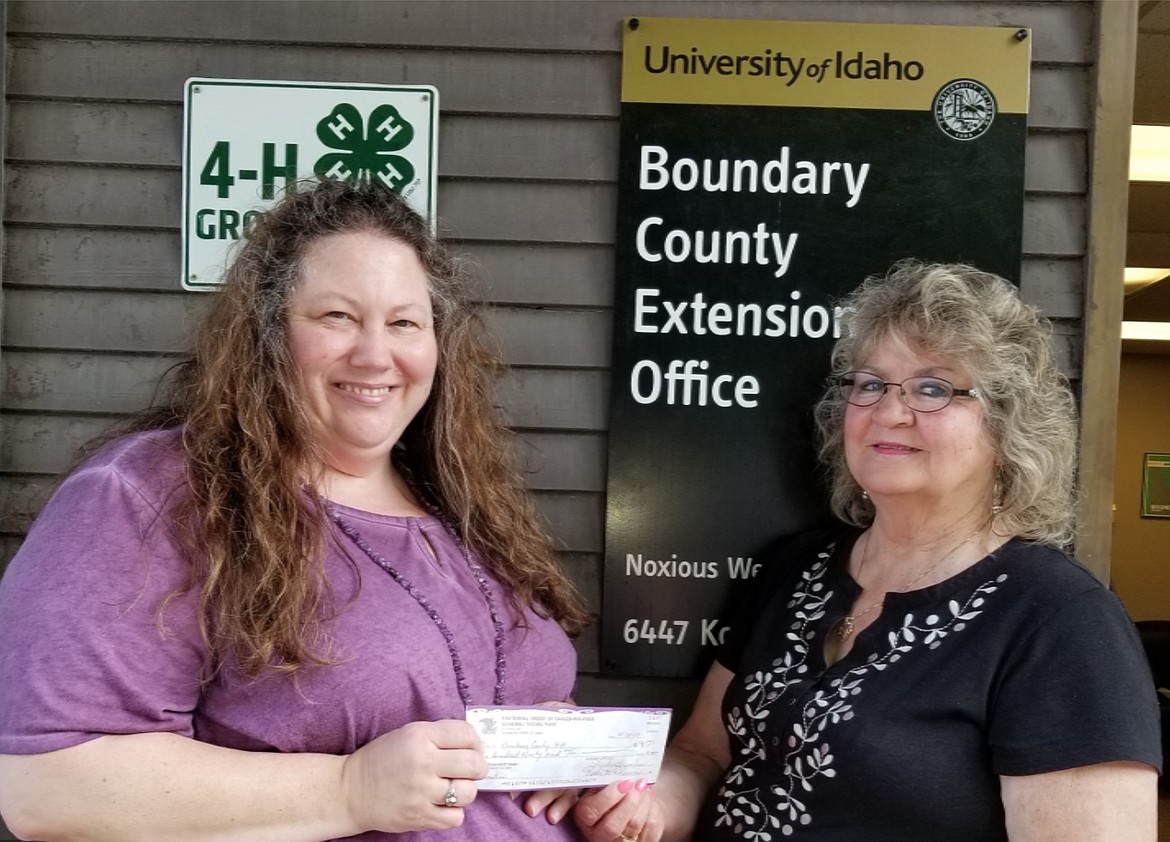 Courtesy photo
Deborah Higgins accepts a donation check from Shirley Brooks. At the end of April, the Eagles Ladies Auxiliary Aerie 3522 held a basket raffle for the Boundary County 4-H Program. The money raised will help fund nine summer day camps for kids age 8-12 in Boundary County with snacks and supplies. Thanks to the support of the Eagles Ladies Auxiliary, $190 was raised. The day camps will include but not limited to Science, Technology, Outdoor Adventure, Gardening, a Farm Tour and Cooking. Call the Extension office at 208-267-3235 to sign up.