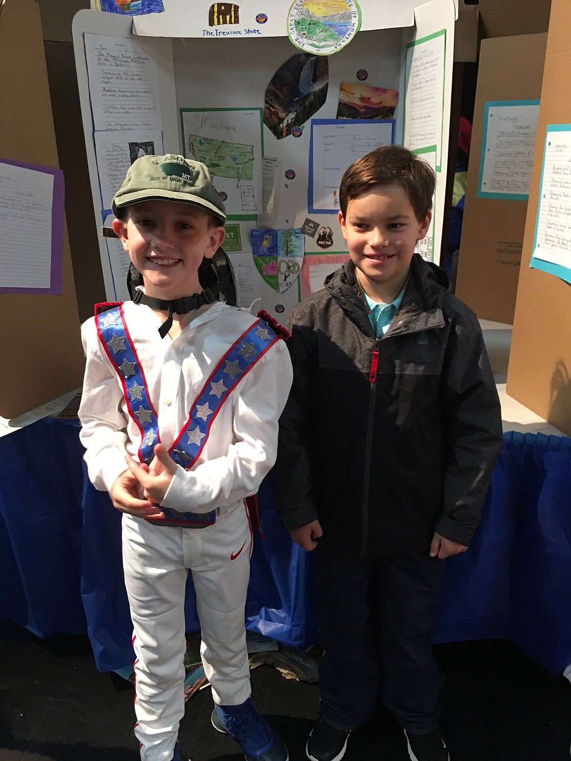 Liam McConaughy, left, dressed as Evel Knievel, and Charley Meyer stand in front of their “State Fair” presentation on Montana. (Courtesy photo)