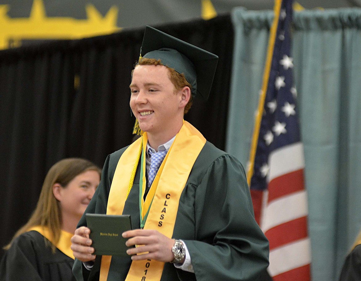 Whitefish graduate Tait Workman smiles after receiving his diploma Saturday during the commencement ceremony at Whitefish High School. There were 112 seniors who graduated during the ceremony at the gym. (Heidi Desch/Whitefish Pilot)