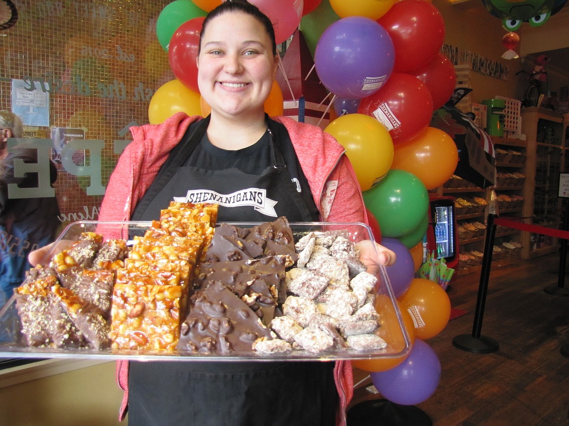 Mallary Jaurez, manager of Shenanigans Sweets and Treats, shows off a sample of the enticing candies available at the downtown Coeur d&#146;Alene candy store. (KEITH ERICKSON/Coeur Voice)