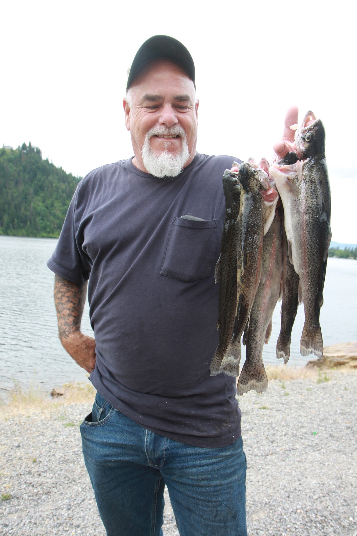 Coeur d&#146;Alene angler George McGinty has been fishing Fernan Lake for more than 20 years. On Wednesday he limited out on rainbows around noon using garlic Powerbait.
RALPH BARTHOLDT/
Press