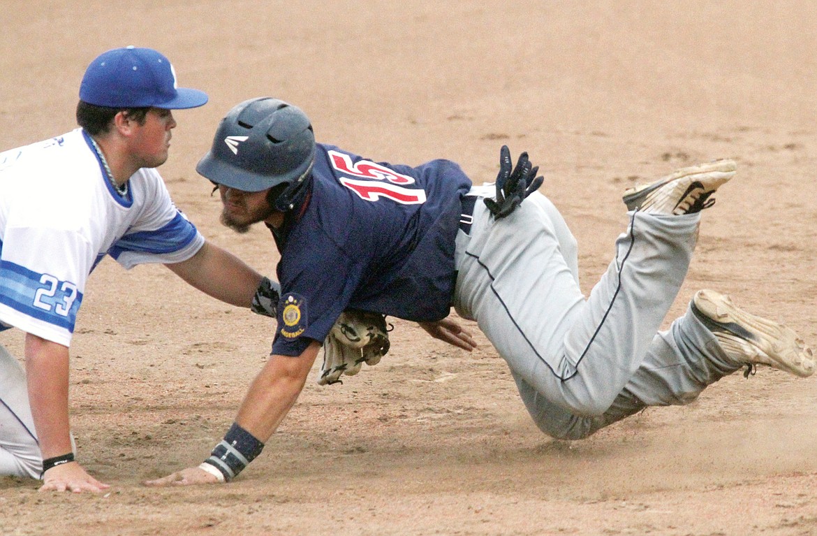 Libby third baseman Garrett Gollahon puts the tag on Jake Scully for the second out of the top of the third inning in the second game of a doubleheader versus Bitterroot Bucs Saturday. (Paul Sievers/The Western News)