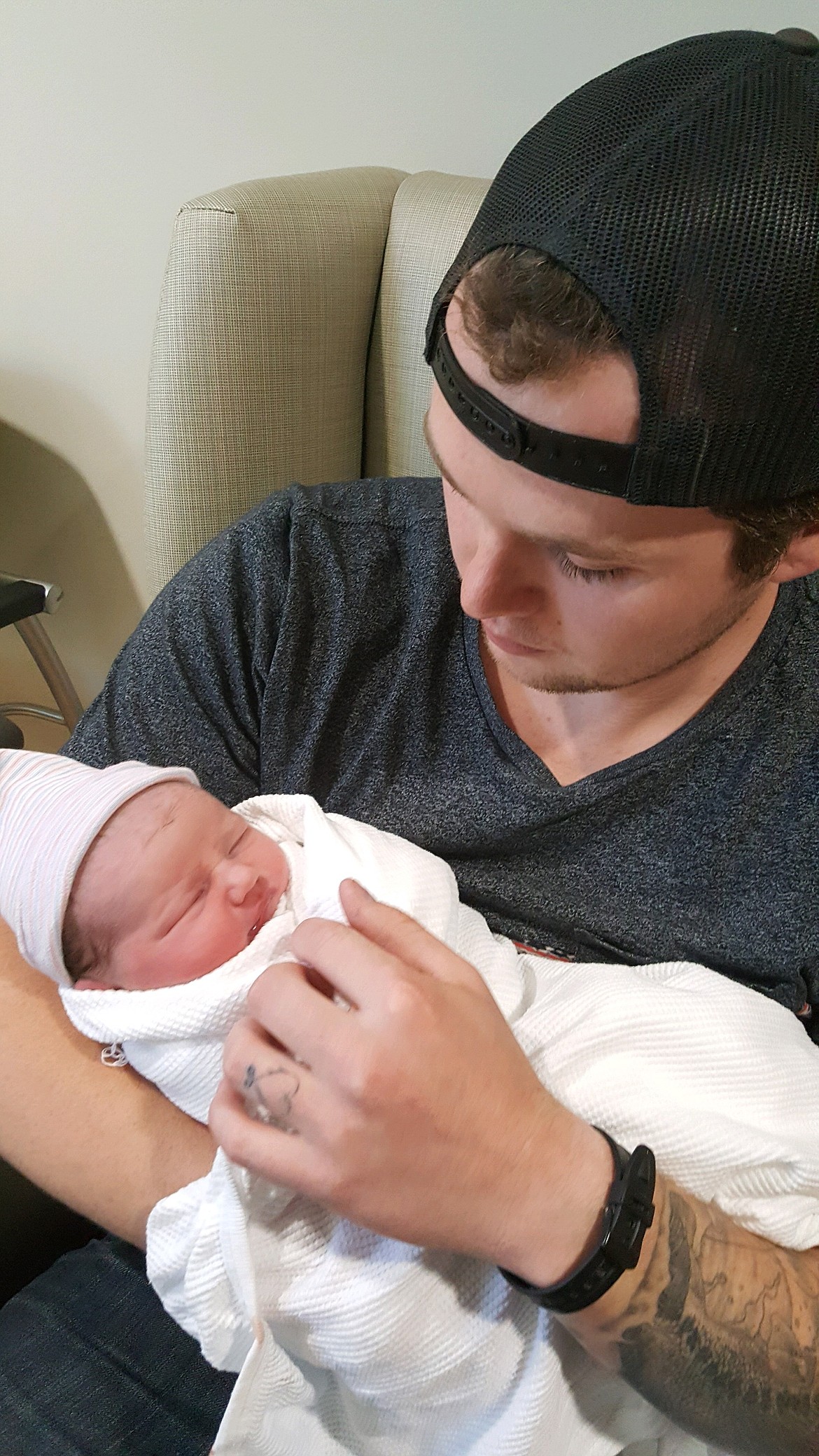 Cody Johnson holds his new daughter at Kootenai Health. (Courtesy photo)