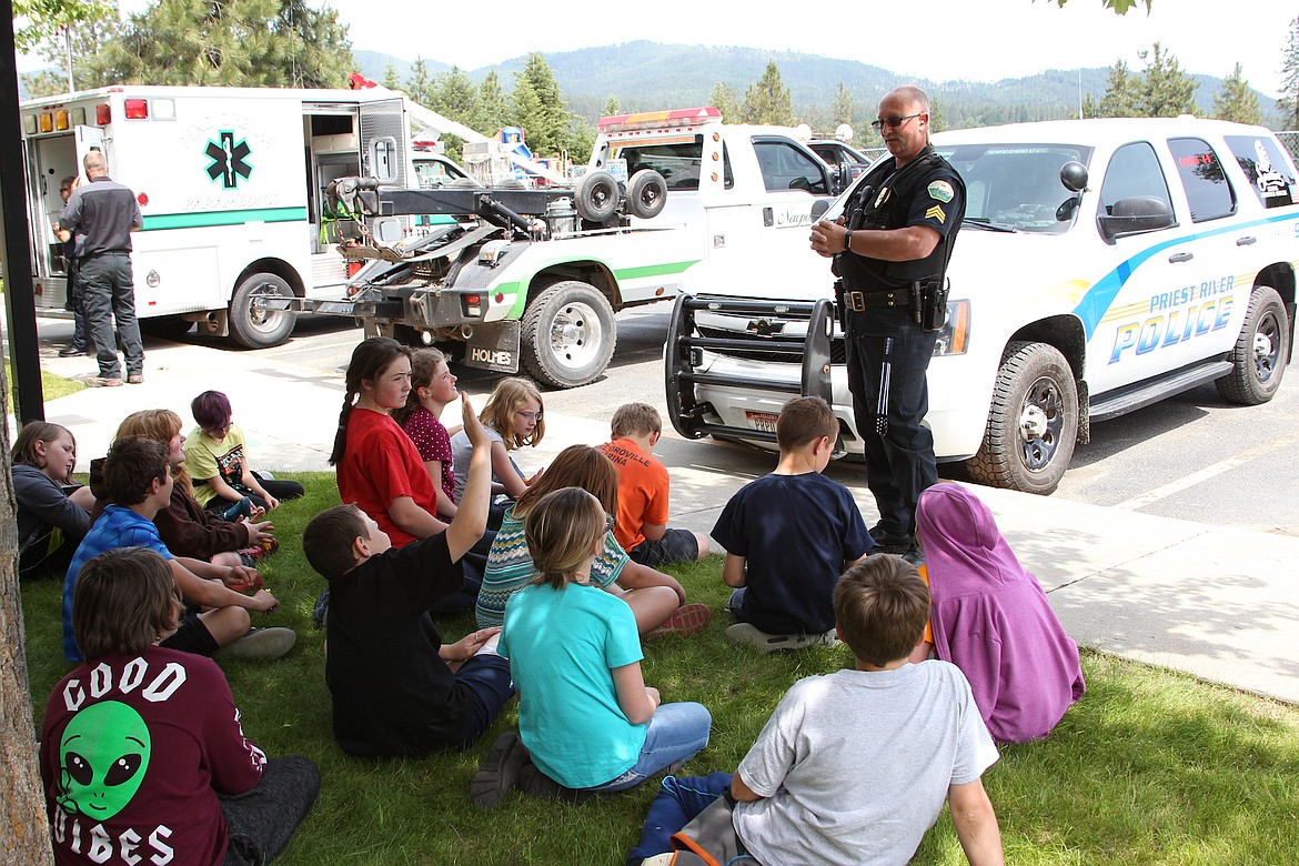 Priest River Police Officer Chris Davis gives a presentation to fifth graders at Idaho Hill&#146;s Safety Day.

(Photo by 
KEITH KINNAIRD