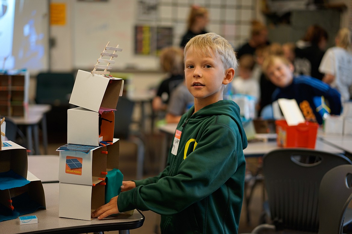 Henry Boyes fixes up his mansion design at Camp Invention at Whitefish Middle School last week. (Daniel McKay photos/Whitefish Pilot)