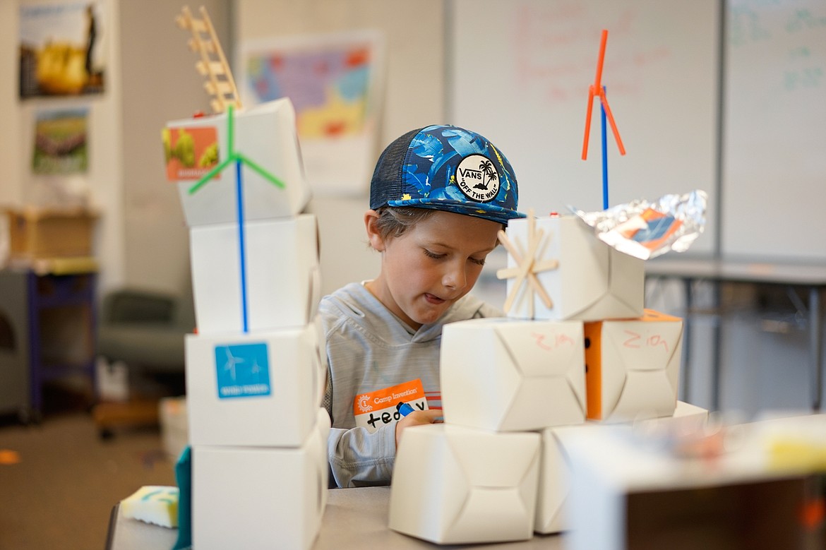 Zion Brown builds his futuristic mansion out of a variety of materials at Camp Invention at Whitefish Middle School last week.