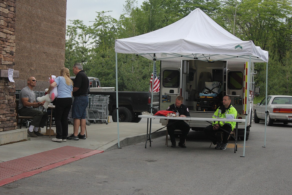 Photo by TANNA YEOUMANS
First responders from Boundary Ambulance came to show their support and answer questions, while the neighboring booth informed and sought support for the Fourth of July firework celebration.