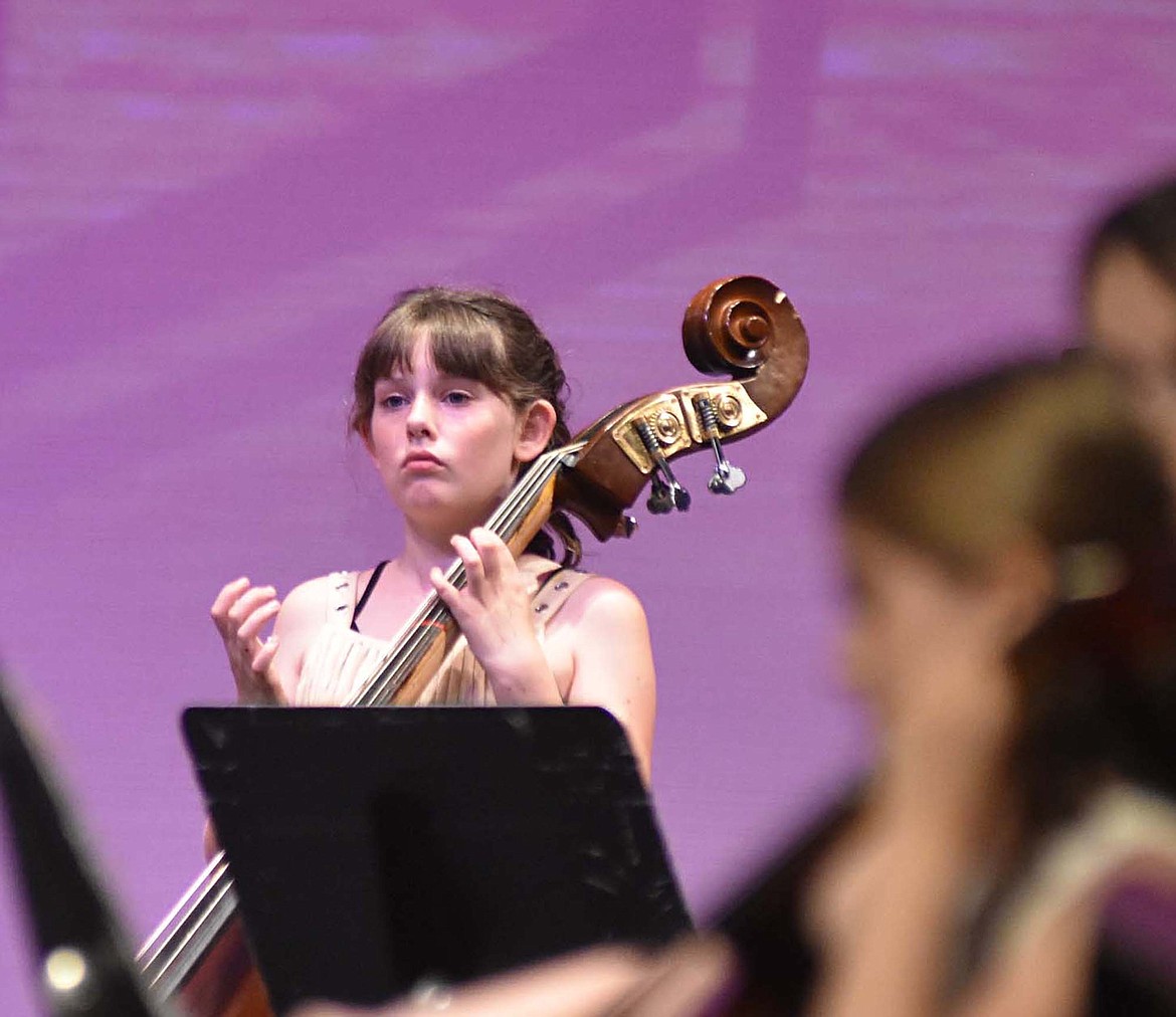 Sixth-grader Sofia Chelmo plays the bass during the orchestra concert. The sixth-grade orchestra performed five songs during the evening.