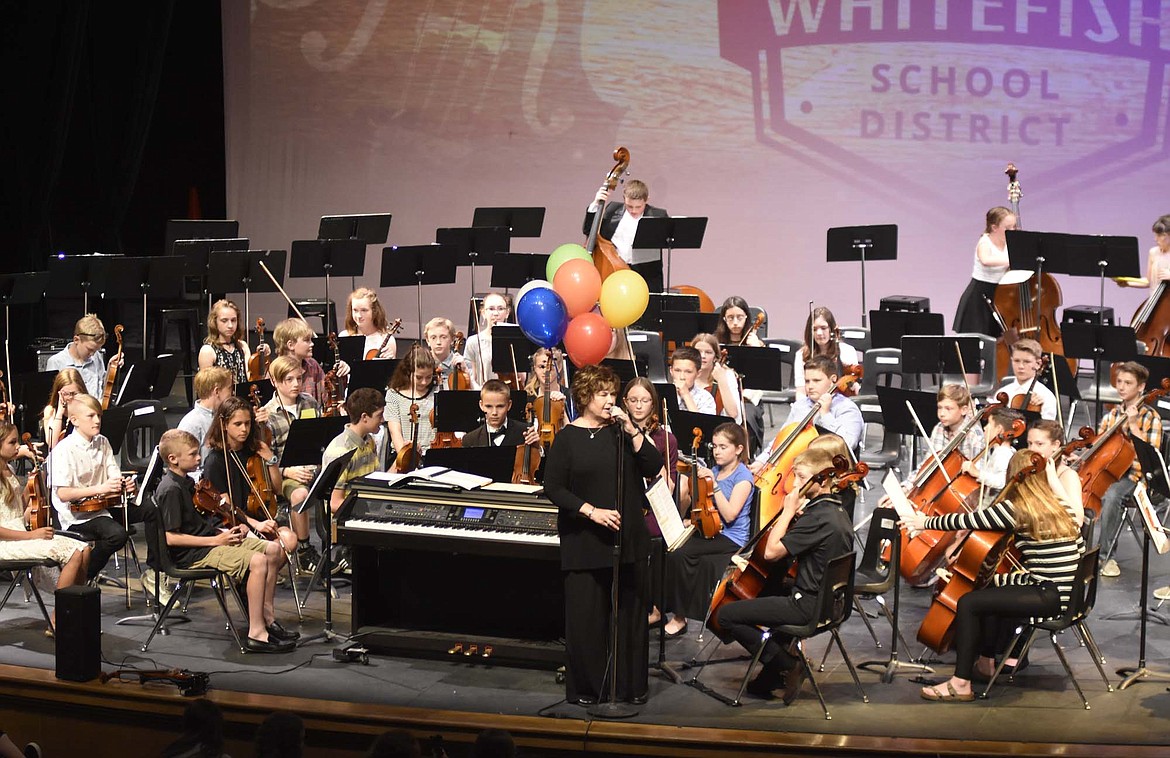 Orchestra director Jennane Solberg speaks to the audience as the Whitefish Middle School sixth-grade orchestra gets ready to perform during a recent concert at the Whitefish Performing Arts Center. Students in sixth, seventh and eighth grade performed during the last concert of the school year. (Heidi Desch/Whitefish Pilot)