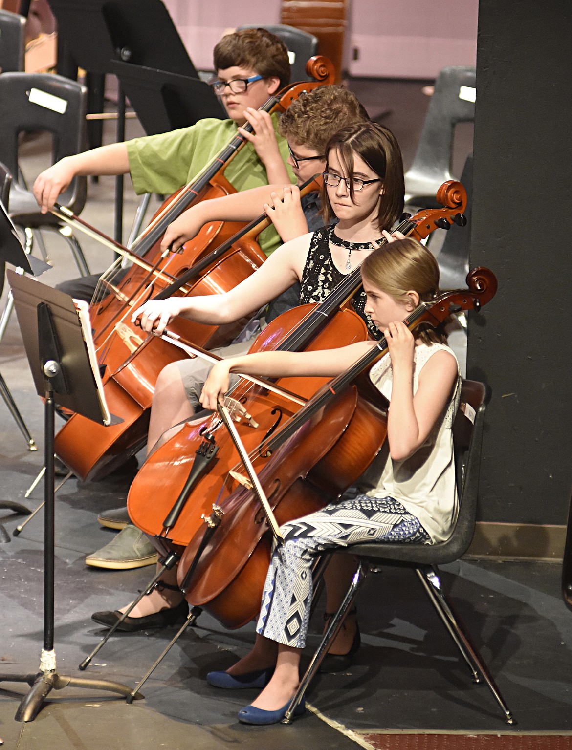 Students Jasper Clark, Cole Pickert, Ella Walker,&#160; Kayla Saxten play as part of the cello section during the concert at the Whitefish Performing Arts Center.