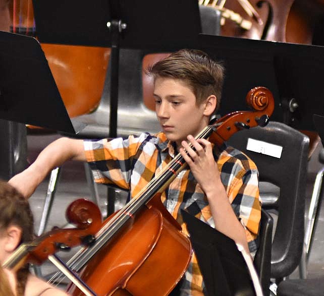 Sixth-grader Kameron Porter plays the cello during the concert.