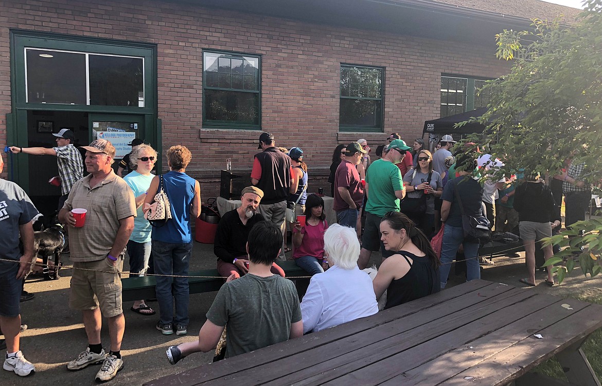 Locals enoy the beer garden at the Silver Valley Farmers&#146; Market.